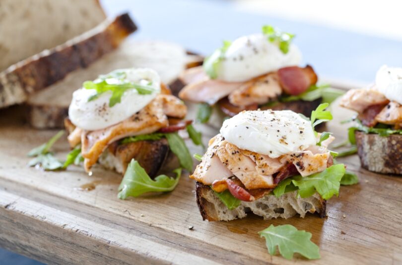 Sautéed Verlasso Salmon with Poached Farm Egg and Applewood Smoked Bacon on Sourdough