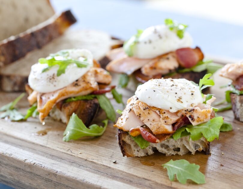 Sautéed Verlasso Salmon with Poached Farm Egg and Applewood Smoked Bacon on Sourdough