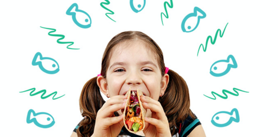 girl eating fish taco for benefits of seafood