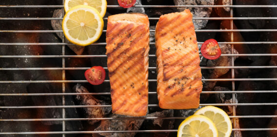 Grilled salmon fillets on the flaming.