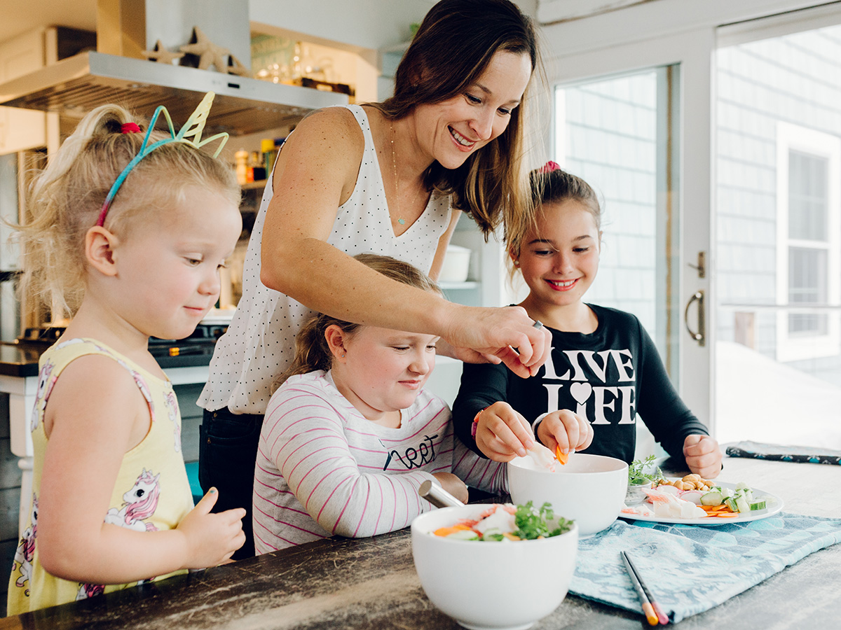 Dana White and her three daughters cooking and eating seafood