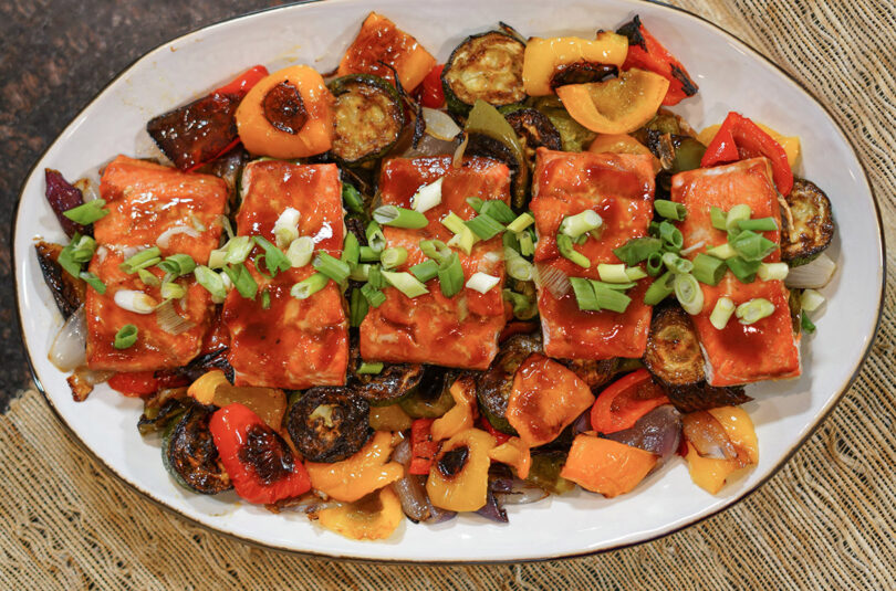 BBQ salmon is an easy and delicious one "pan" meal with the main dish and side dish cooked to perfection right on the grill!