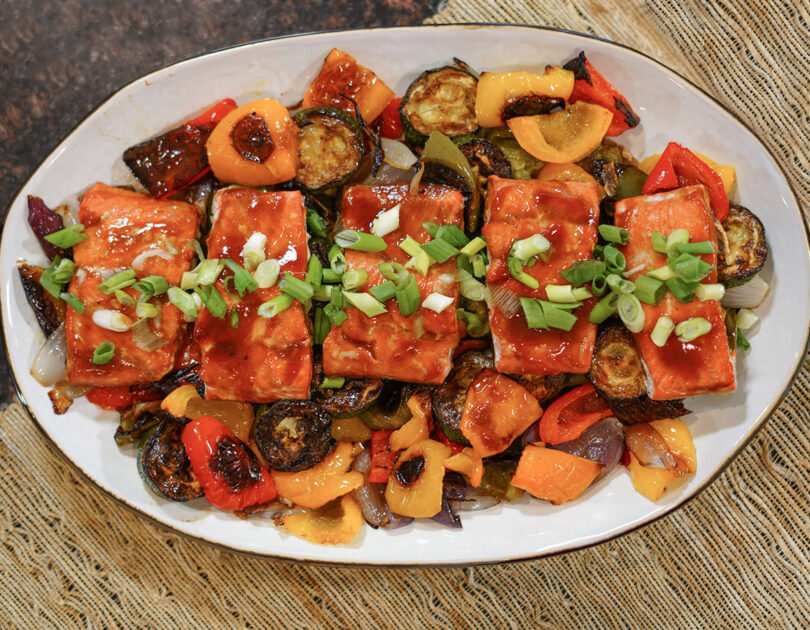 BBQ salmon is an easy and delicious one "pan" meal with the main dish and side dish cooked to perfection right on the grill!