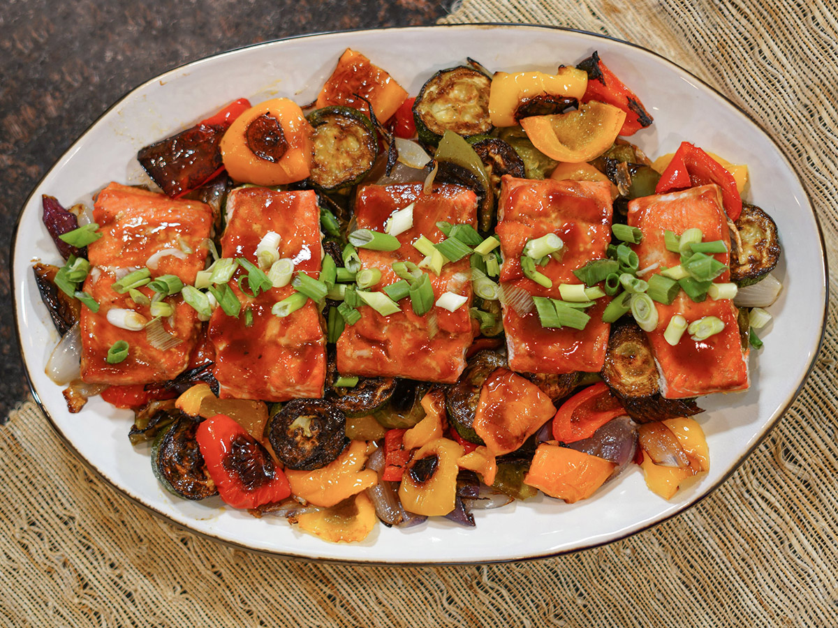 BBQ salmon is an easy and delicious one "pan" meal with the main dish and side dish cooked to perfection right on the grill!