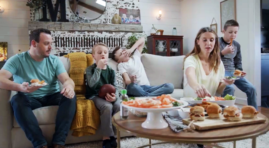 Dietitian Jessica and her family celebrate gameday with a seafood spread including shrimp cocktail and buffalo salmon sliders.